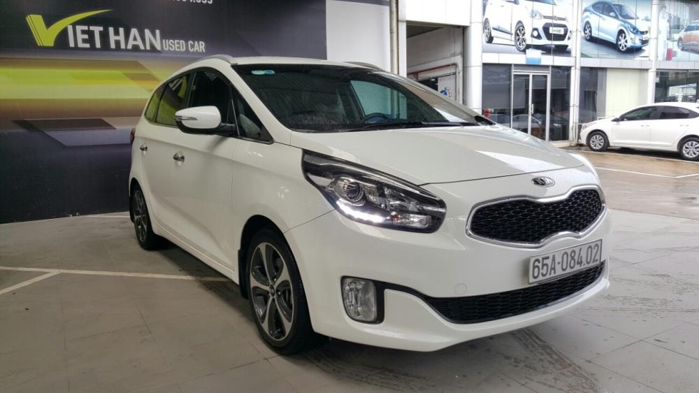 Kia Rondo GAT 2.0AT 2014 - Bán Kia Rondo Gat 2.0 AT màu trắng, số tự động, sản xuất T12/2014 biển tỉnh, lăn bánh 56000km