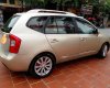 Kia Carens 2011 - Cần bán lại xe Kia Carens đời 2011, màu vàng số sàn