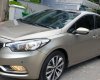 Kia K3 1.6 AT  2013 - Bán Kia K3 1.6 AT số tự động model 2014, Sx 2013, màu vàng 1 đời chủ mới 90%