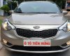 Kia K3 1.6 AT  2013 - Bán Kia K3 1.6 AT số tự động model 2014, Sx 2013, màu vàng 1 đời chủ mới 90%