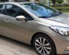 Kia K3 1.6 AT  2013 - Bán Kia K3 1.6 AT số tự động model 2014, Sx 2013, màu vàng 1 đời chủ mới 90%