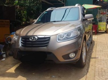 Hyundai Santa Fe 2011 - Cần bán lại xe Hyundai Santa Fe năm 2011, màu vàng, nhập khẩu, 590tr